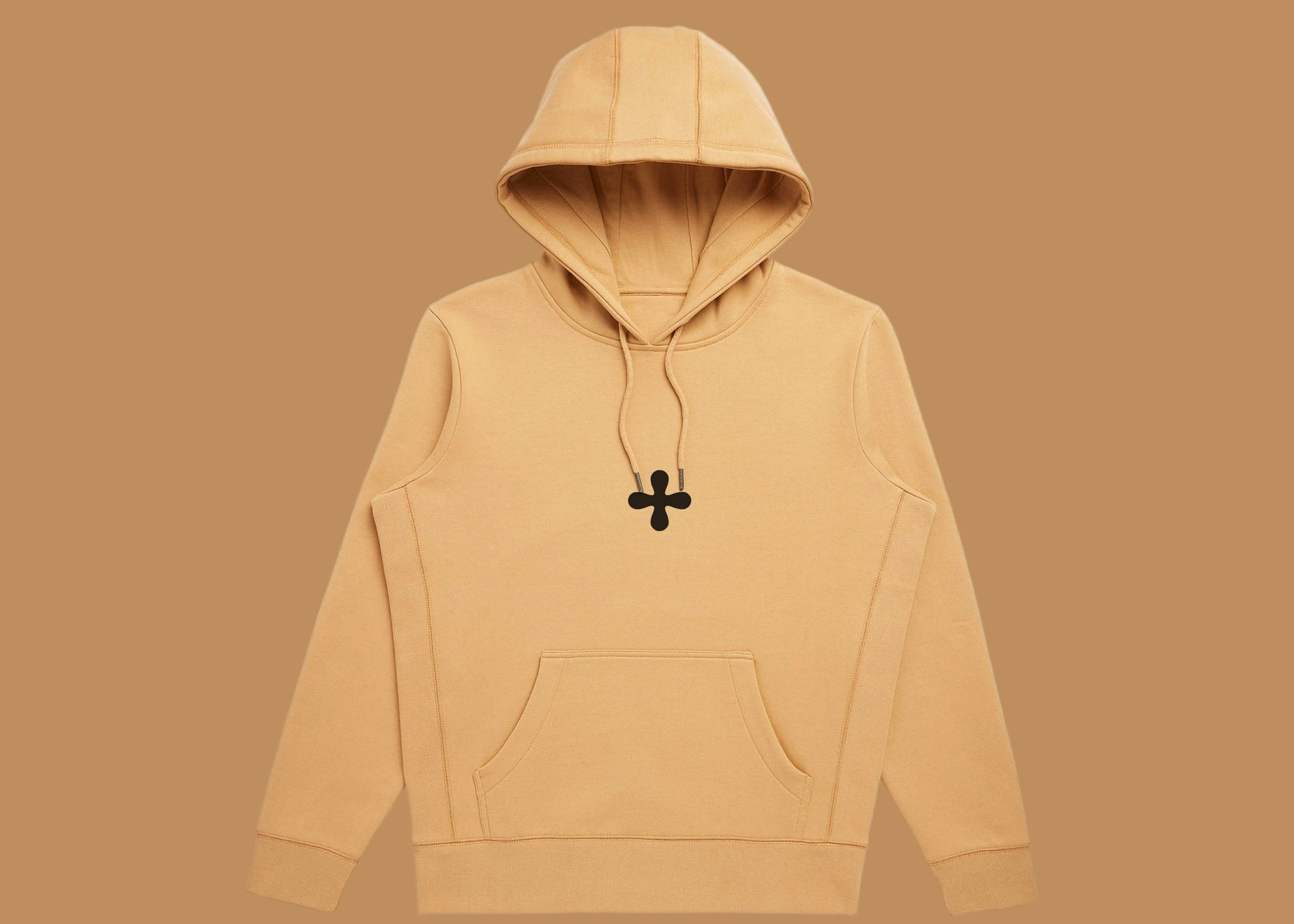 Beige hoodie with a black pendant on a white background